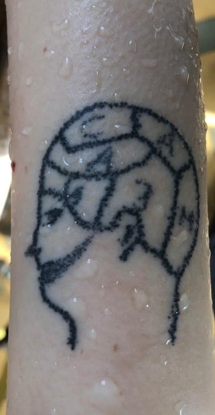 Тату на тілі загиблої. Фото поліції